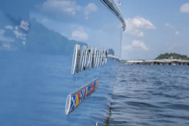  Yacht Photos Pics 2024 Monterey 385SS boat on water, showcasing sleek design and branding.