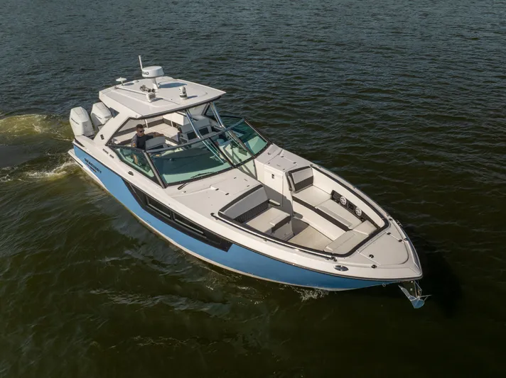  Yacht Photos Pics 2024 Monterey 385SS boat cruising on open water, showcasing sleek design and luxury features.