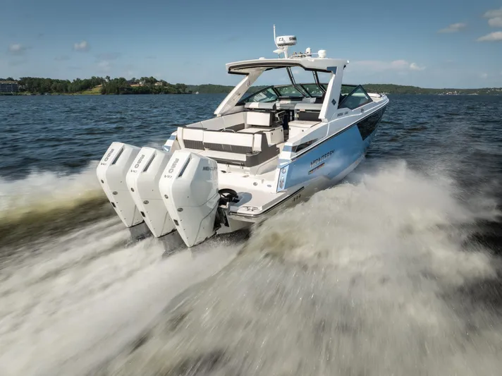  Yacht Photos Pics 2024 Monterey 385SS boat cruising on a lake with powerful outboard engines.