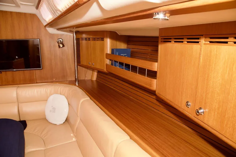  Yacht Photos Pics Luxurious interior of 2005 X-Yachts X-562 with wooden cabinetry and leather seating.