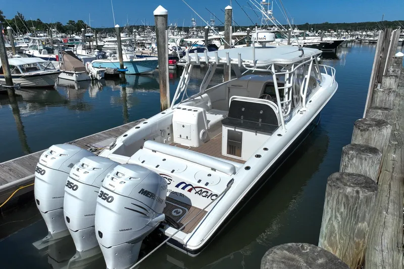  Yacht Photos Pics 2007 Midnight Express 37 Cabin boat docked with triple Mercury 350 engines.
