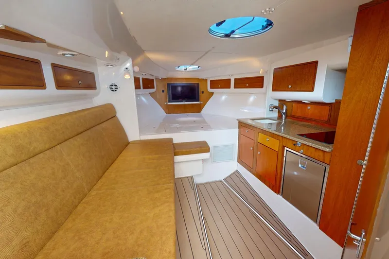  Yacht Photos Pics Luxurious interior of 2007 Midnight Express 37 Cabin boat with wood accents and modern amenities.