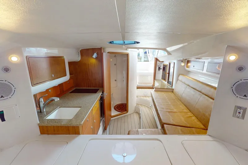  Yacht Photos Pics Luxurious interior of 2007 Midnight Express 37 Cabin boat with kitchenette and seating area.