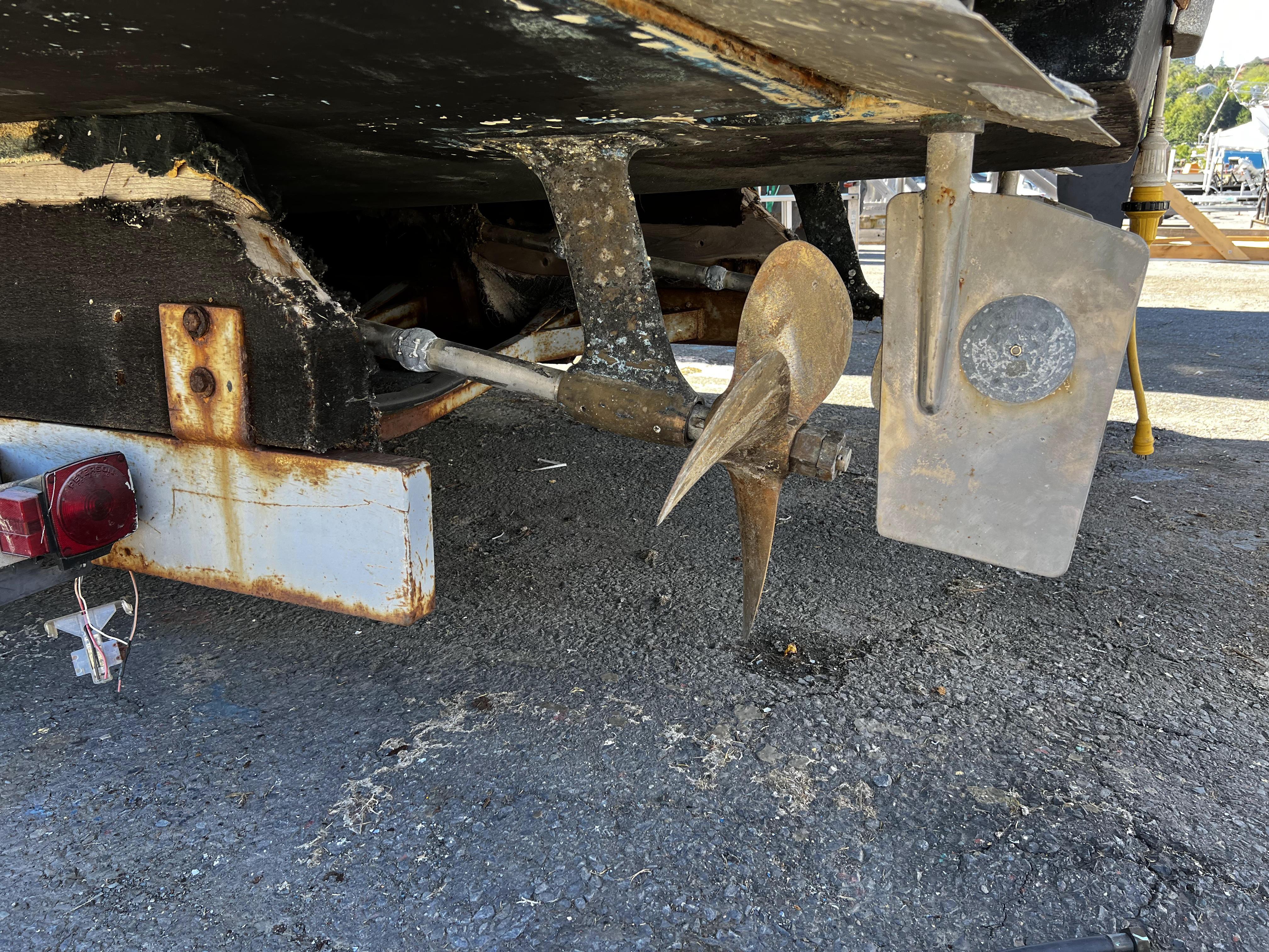 1988 Pace 40 Sport Fisherman boat propeller and rudder on dry dock.