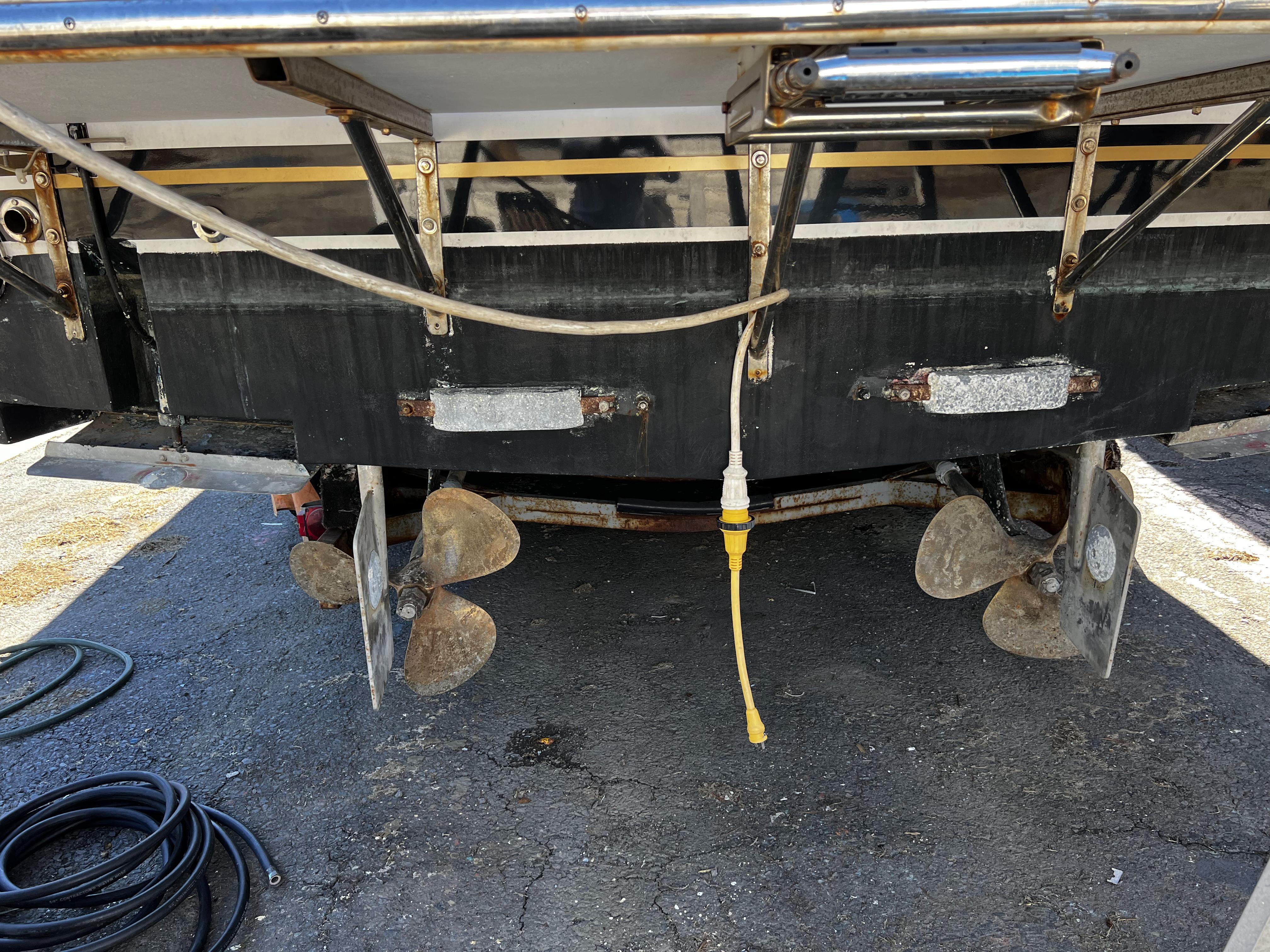 1988 Pace 40 Sport Fisherman boat stern with dual propellers and electrical connection.