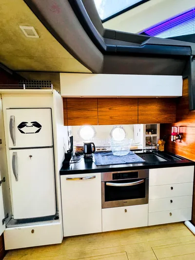  Yacht Photos Pics Modern kitchen in 2011 Absolute Sixty 4 yacht with sleek appliances and wood accents.