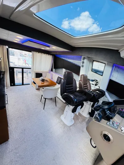  Yacht Photos Pics Luxurious interior of 2011 Absolute Sixty 4 yacht with skylight and modern seating.