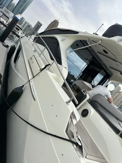  Yacht Photos Pics Luxury yacht Absolute Sixty 4, 2011 model, docked at marina with city skyline.