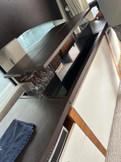  Yacht Photos Pics Interior of 2011 Absolute Sixty 4 yacht with sleek cabinetry and glassware storage.