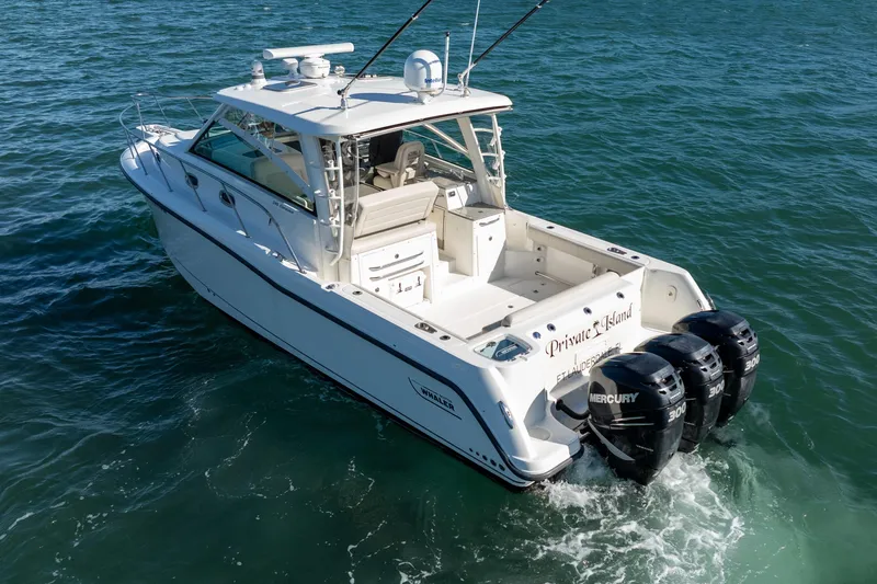  Yacht Photos Pics 2015 Boston Whaler 345 Conquest boat with triple Mercury engines on the water.