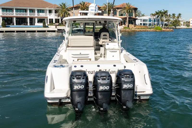  Yacht Photos Pics 2015 Boston Whaler 345 Conquest with four powerful outboard engines on the water.