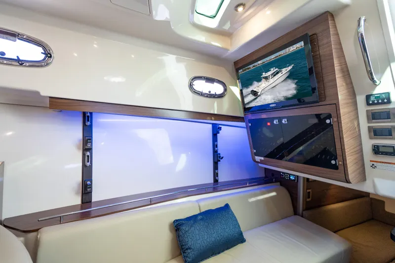  Yacht Photos Pics Luxurious interior of 2015 Boston Whaler 345 Conquest with TV and seating area.