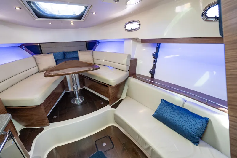  Yacht Photos Pics Luxurious interior of 2015 Boston Whaler 345 Conquest with plush seating and elegant wood finishes.