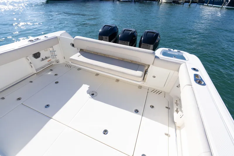  Yacht Photos Pics 2015 Boston Whaler 345 Conquest boat deck with triple outboard engines.