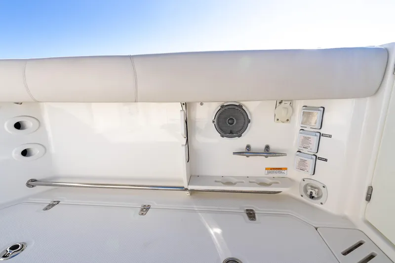  Yacht Photos Pics 2015 Boston Whaler 345 Conquest boat interior with speaker and control panel.