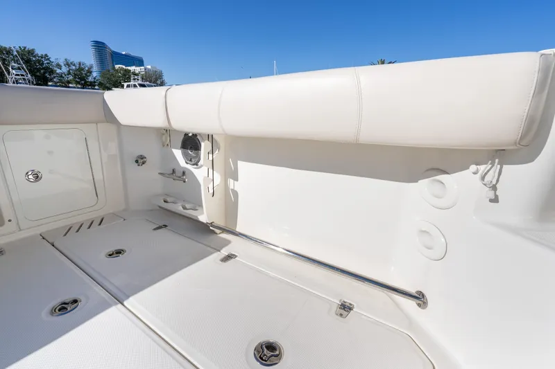  Yacht Photos Pics 2015 Boston Whaler 345 Conquest boat interior with white seating and storage compartments.