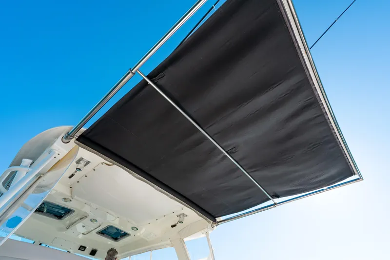  Yacht Photos Pics 2015 Boston Whaler 345 Conquest boat canopy against clear blue sky.