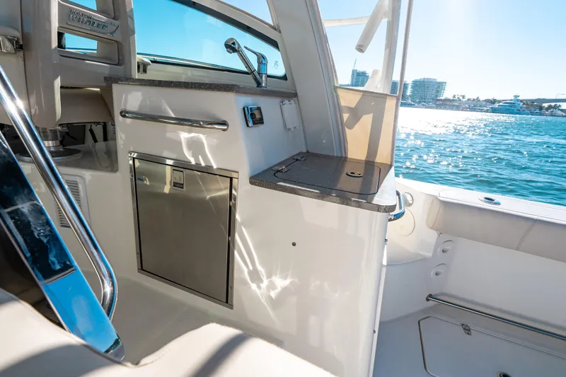  Yacht Photos Pics 2015 Boston Whaler 345 Conquest interior with ocean view, featuring sleek design and modern amenities.
