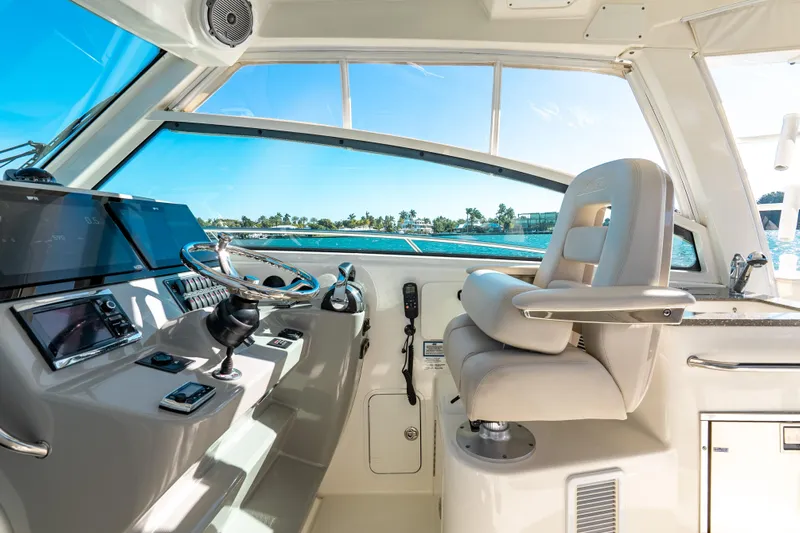  Yacht Photos Pics Helm of 2015 Boston Whaler 345 Conquest with luxurious seating and modern controls.