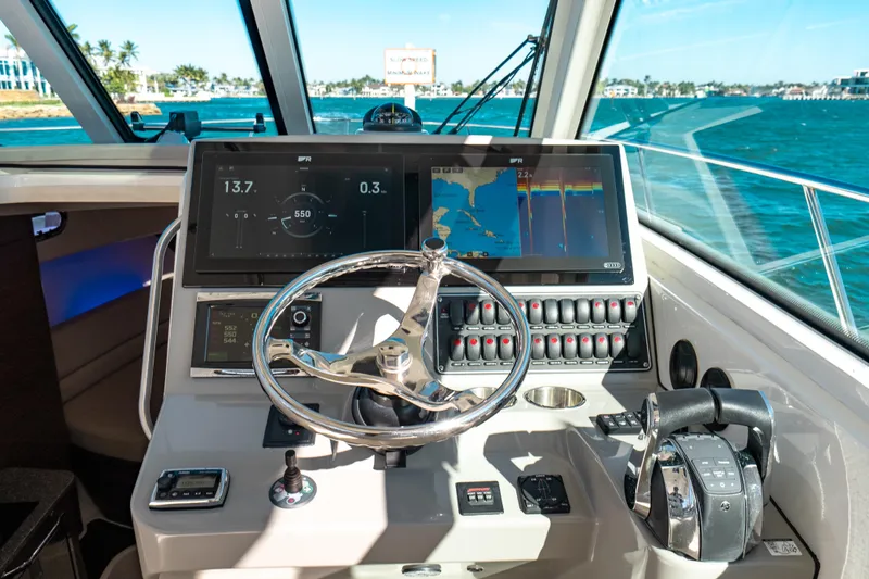  Yacht Photos Pics 2015 Boston Whaler 345 Conquest helm with advanced navigation displays and controls.