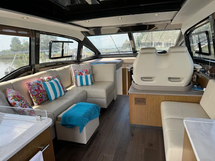 Graceful Yacht Photos Pics Luxurious interior of 2017 Sea Ray Sundancer 460 yacht with plush seating and vibrant decor.