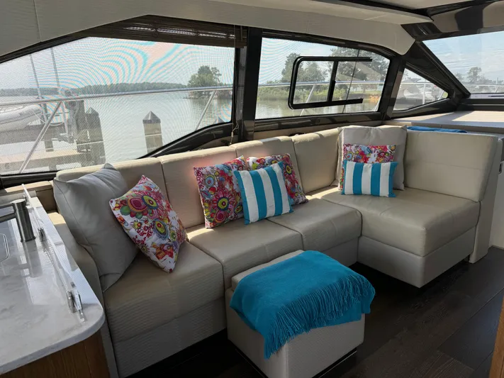 Graceful Yacht Photos Pics Luxurious interior of 2017 Sea Ray Sundancer 460 yacht with stylish seating and colorful cushions.