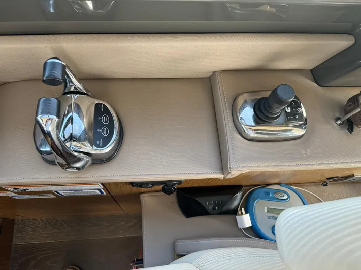 Graceful Yacht Photos Pics Control panel of a 2017 Sea Ray Sundancer 460 yacht with throttle and joystick.