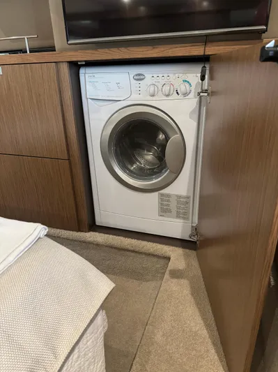 Graceful Yacht Photos Pics Washing machine inside 2017 Sea Ray Sundancer 460 yacht's wooden cabinet.