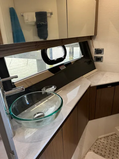 Graceful Yacht Photos Pics 2017 Sea Ray Sundancer 460 bathroom with modern glass sink and wood cabinetry.