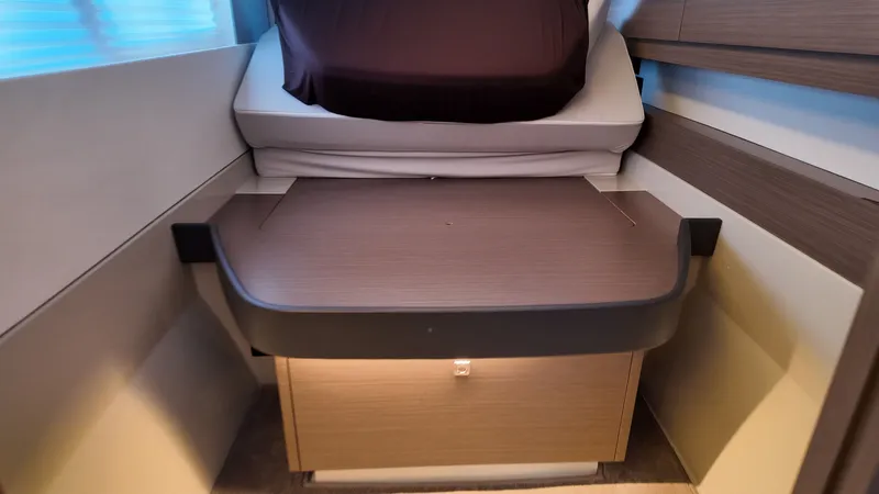 Tut Yacht Photos Pics Interior of Leopard 42 Sail 2025 with foldable table and bed.