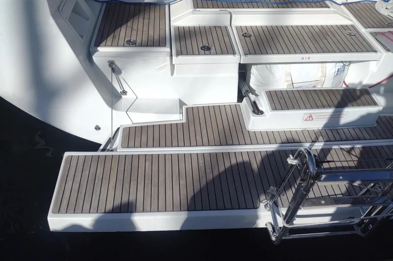  Yacht Photos Pics Stern view of 2018 Beneteau Oceanis 48 yacht with teak decking and swim ladder.