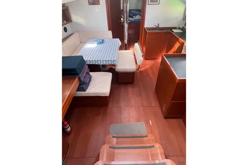  Yacht Photos Pics Interior of 2018 Beneteau Oceanis 48 yacht with dining area and kitchen.