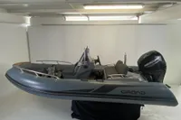 2020 Grand G420 inflatable boat with Mercury engine in a showroom setting.