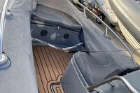 2020 Grand G420 boat interior with gray seating and wooden deck.