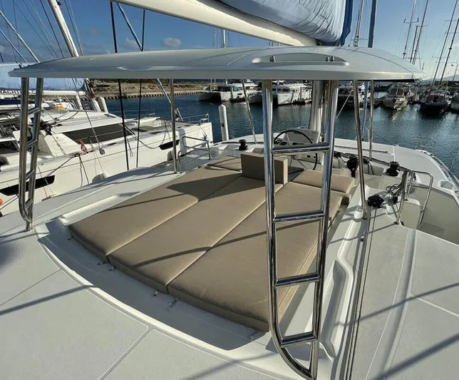 Kowi Kai Yacht Photos Pics 2020 Lagoon 50 catamaran with sunbathing area and ladder, docked at marina.