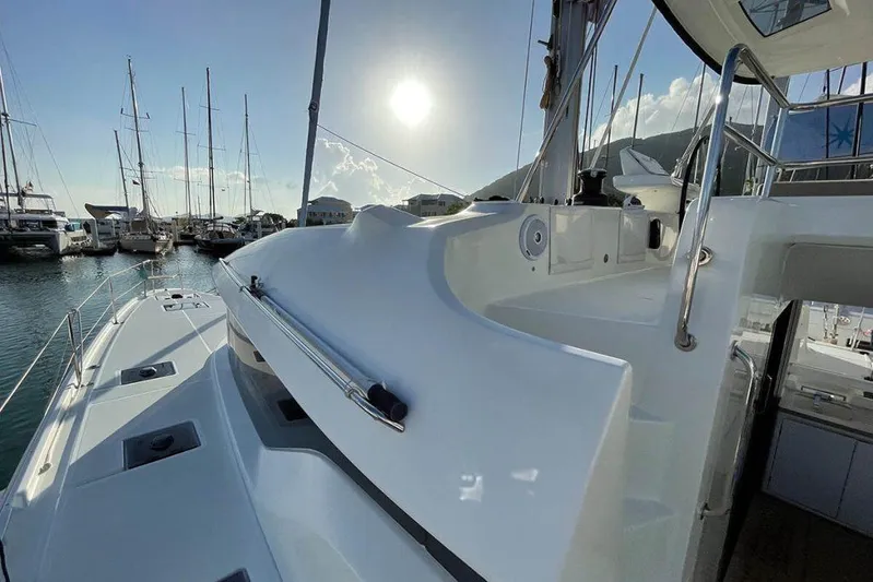 Kowi Kai Yacht Photos Pics Lagoon 50 catamaran, 2020 model, docked in a marina with sunlit deck.