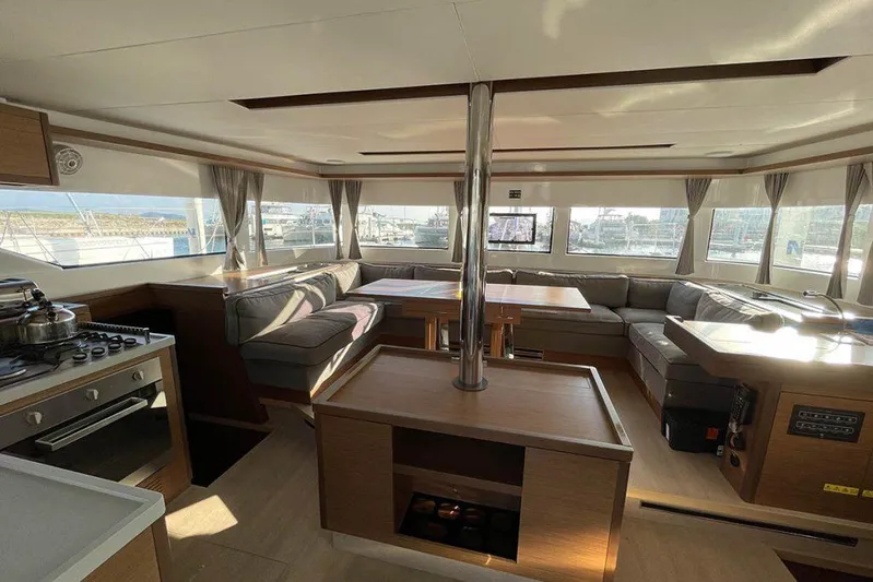 Kowi Kai Yacht Photos Pics Spacious interior of 2020 Lagoon 50 catamaran with modern kitchen and seating area.