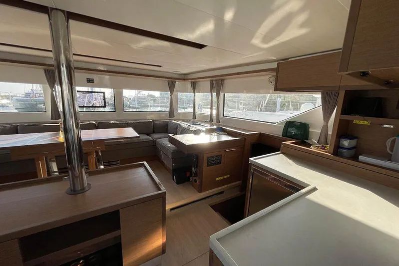 Kowi Kai Yacht Photos Pics Interior of 2020 Lagoon 50 catamaran, featuring spacious seating and modern kitchen area.