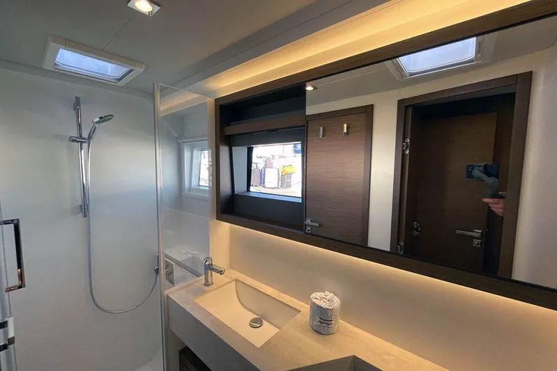 Kowi Kai Yacht Photos Pics Modern bathroom interior of 2020 Lagoon 50 yacht with sleek fixtures and ambient lighting.