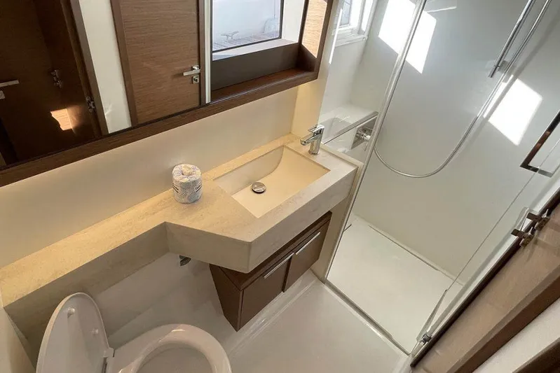 Kowi Kai Yacht Photos Pics Modern bathroom in 2020 Lagoon 50 yacht with sleek sink and shower.