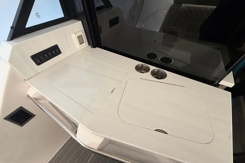  Yacht Photos Pics 2022 Regal 38 XO yacht interior with sleek countertop and control panel.