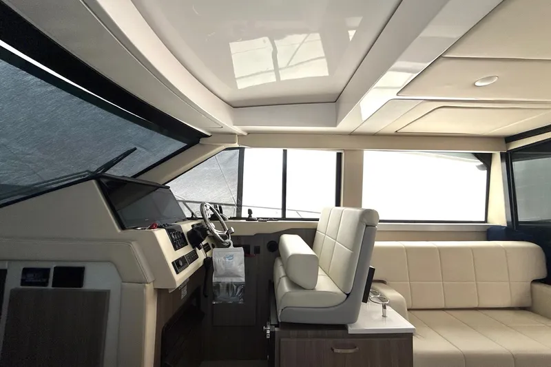  Yacht Photos Pics Interior of 2022 Regal 38 XO yacht with modern helm and seating area.