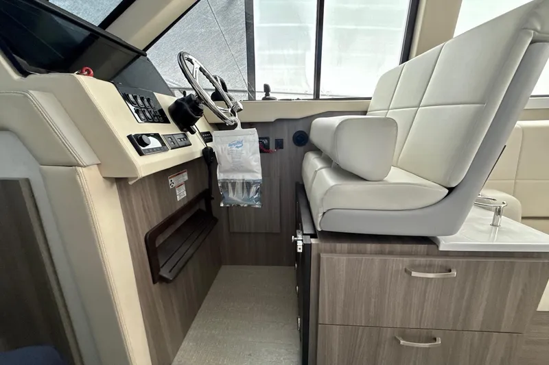  Yacht Photos Pics Helm station of 2022 Regal 38 XO boat with modern controls and seating.