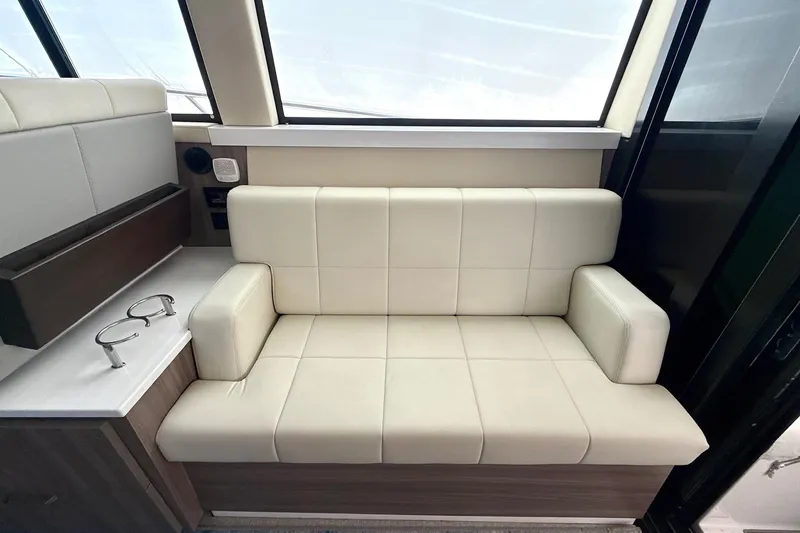  Yacht Photos Pics Luxurious interior seating on 2022 Regal 38 XO yacht, featuring cream leather upholstery.