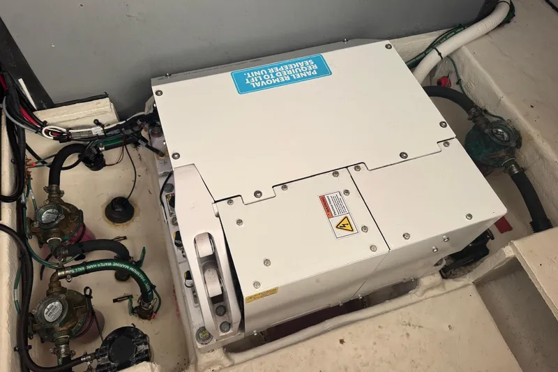  Yacht Photos Pics Engine compartment of 2022 Regal 38 XO boat, featuring mechanical components and wiring.