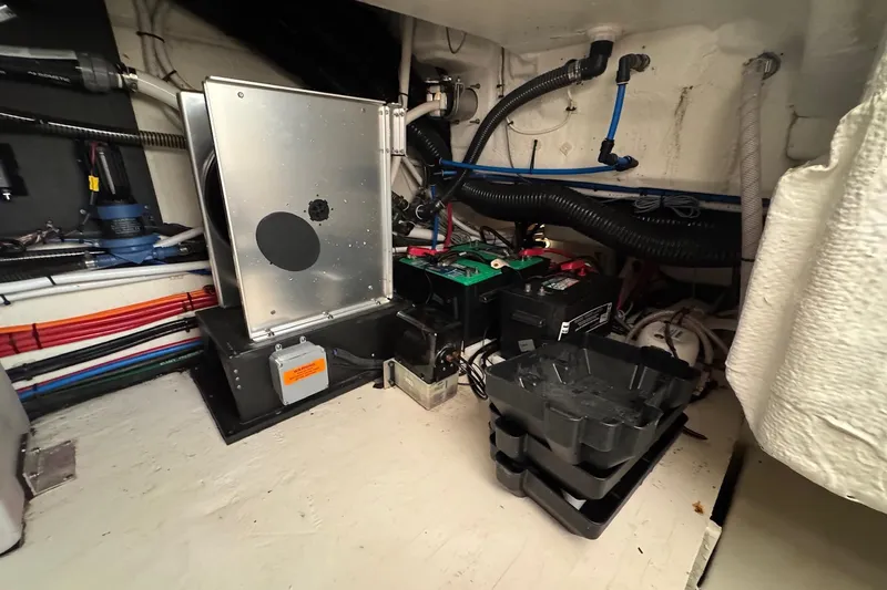  Yacht Photos Pics Engine room of 2022 Regal 38 XO boat with wiring and battery components.