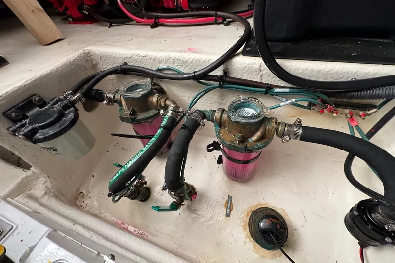  Yacht Photos Pics Engine compartment of a 2022 Regal 38 XO boat showing fuel filters and hoses.