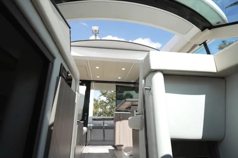  Yacht Photos Pics Interior view of 2022 Regal 38 XO yacht with modern design and skylight.