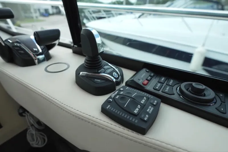  Yacht Photos Pics Control panel of 2022 Regal 38 XO boat, featuring joystick and navigation controls.