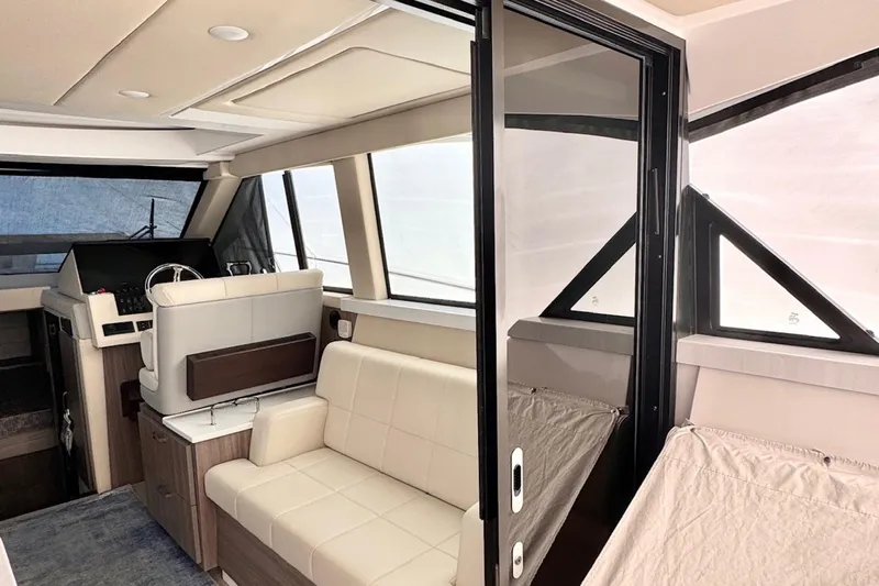  Yacht Photos Pics Interior of 2022 Regal 38 XO yacht with modern seating and helm.